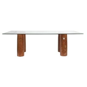 A Modern Italian travertine and glass dining table