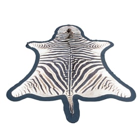 An antique zebra rug, 85" x 40"