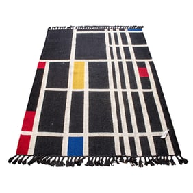 A contemporary hand made flat weave carpet