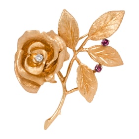 A ruby, diamond, and 14k gold brooch