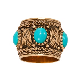 A turquoise and 14k gold ring