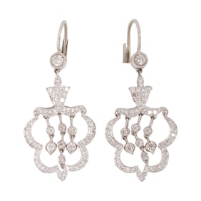 A pair of white gold diamond earrings