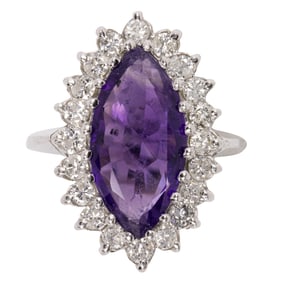 An amethyst, diamond, and 14k white gold ring
