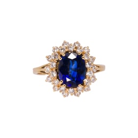 A sapphire, diamond, and 14k gold ring