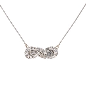 A diamond and platinum pendant necklace