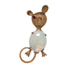 An opal, ruby, and 14k gold brooch