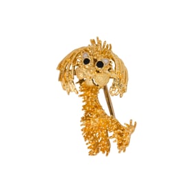 An 18k gold and enamel brooch