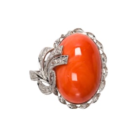 A coral, diamond, and 10k white gold ring
