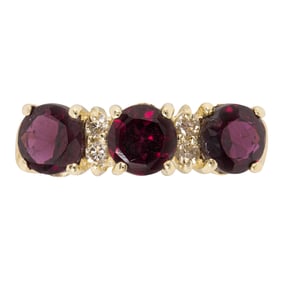 A garnet, diamond, and 14k gold ring