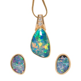 An opal, diamond, and 18k gold pendant necklace and earrings
