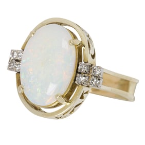 An opal, diamond, and 14k gold ring and opal and 9k gold earrings