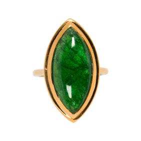 An emerald and 18k gold ring