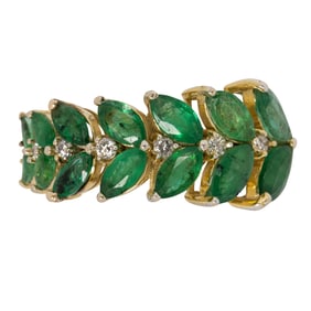 An emerald, diamond, and 18k white gold ring