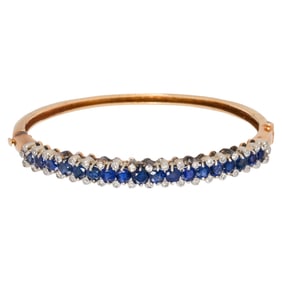 A sapphire, diamond, and 14k gold bangle bracelet