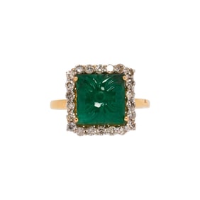 An emerald, diamond and 18k gold ring