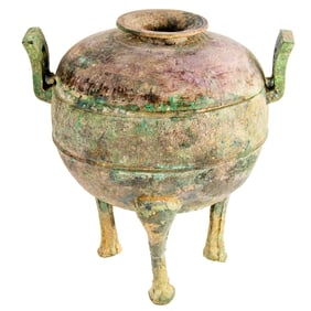 A Chinese Han dynasty bronze tripod ding