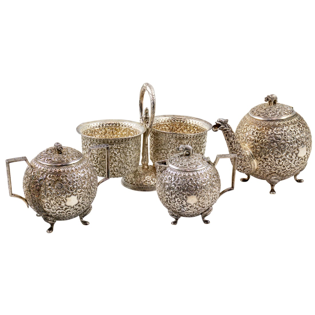 A four-piece Indian silver repousse tea set (1 of 3)