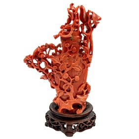 A Chinese carved red coral vase