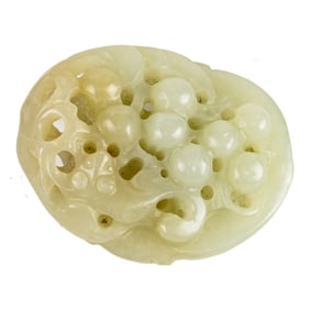 A Chinese celadon jade 'grape vine' toggle