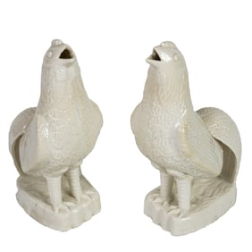 A pair of Dehua cockerel incense stick holders