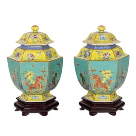 A pair of Chinese famille rose 'lion dogs' hexagonal jars