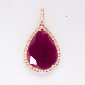 A ruby, diamond, and 18k gold pendant