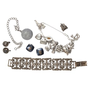 A group of silver and metal jewelry