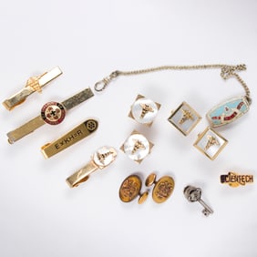 A group of gold tone of fraternal and professional men's accessories