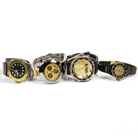 A group of three Guess stainless steel watch of varying designs and styles