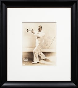 A Louis Armstrong signed promotional photo, Selmer trumpets