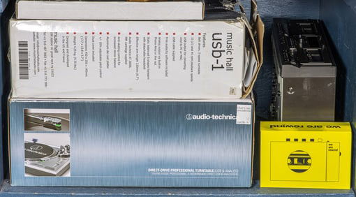 A group of mainly turntables and cassette players, including Audio Technica turntable; Technics