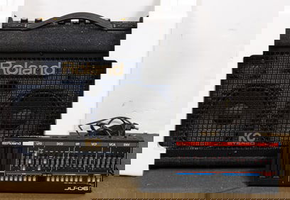 A group of Roland synthesizers and drums, comprising Roland KC Stereo KC110; Roland V-Drum PM-30 and
