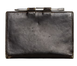 An Hermes brown leather bi-fold note case with silver pen
