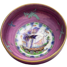 A Minton purple luster porcelain footed bowl