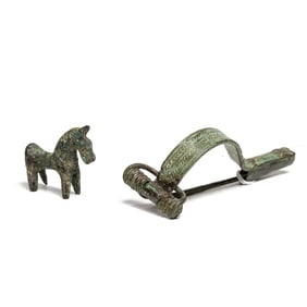 A Roman bronze fibula and a horse figure