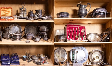 Six shelves of mainly silver plate hollowware and flatware