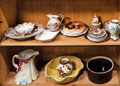 Four shelves of ceramics