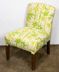 An upholstered chair in cotton floral bamboo pattern