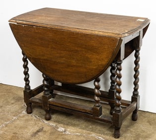 A William and Mary style quarter sewn oak gateleg table
