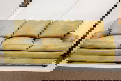 A Lackwana leather three seat sofa