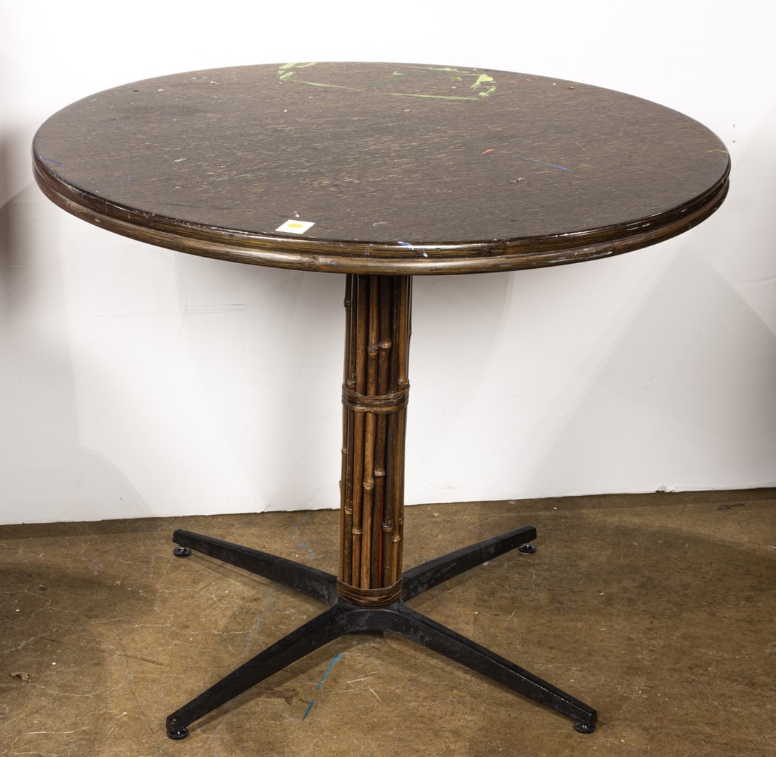 A McGuire circular table with bamboo bound pedestal base: A McGuire circular table with bamboo bound pedestal base, factory label to base, 29.5"h x 36"dia