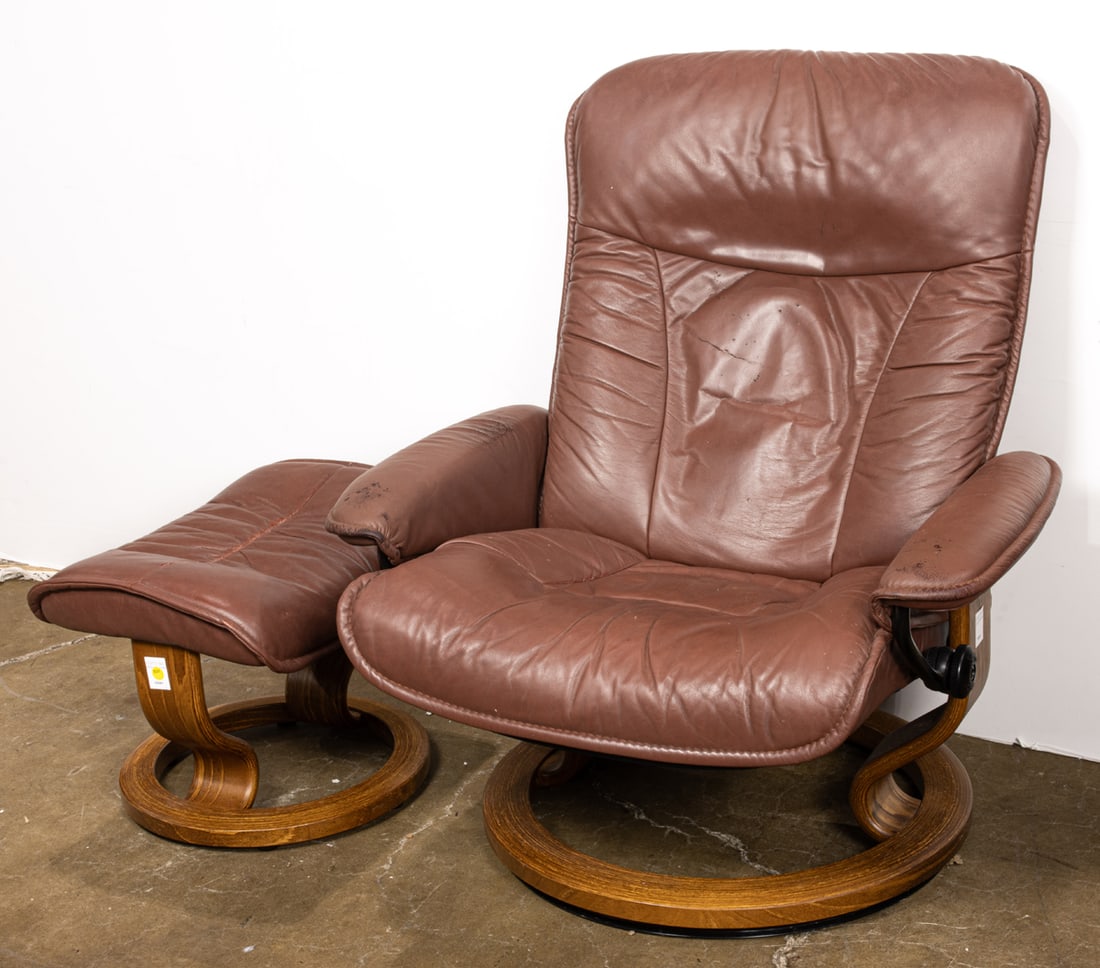 An Ekornes Stressless leather recliner and ottoman: An Ekornes Stressless leather recliner and ottoman, recliner 37"h x 35"w