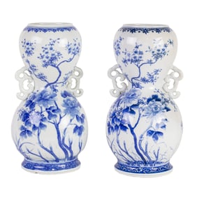 A pair of Japanese Arita blue and white vases