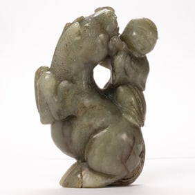 A Chinese celadon jade boy on horse