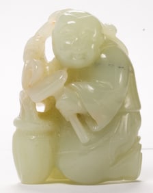 A Chinese celadon jade boy