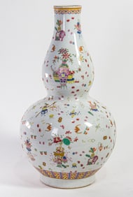 A Chinese famille rose double gourd vase