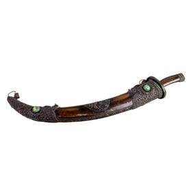 A Mongolian copper with dragon head design and turquoise inlaid sword