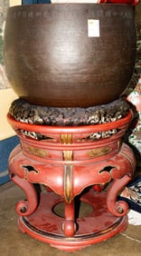A Japanese bronze orin bell on lacquered wood stand