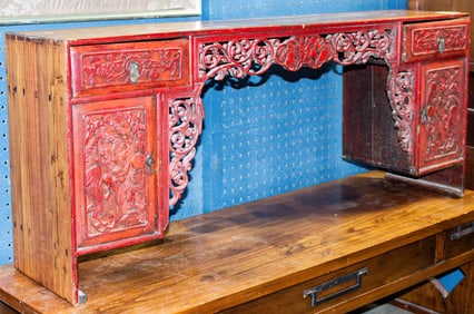 A Chinese red-lacquered carved low table