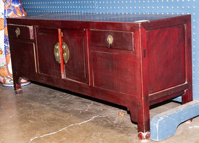 A Chinese elm wood low cabinet